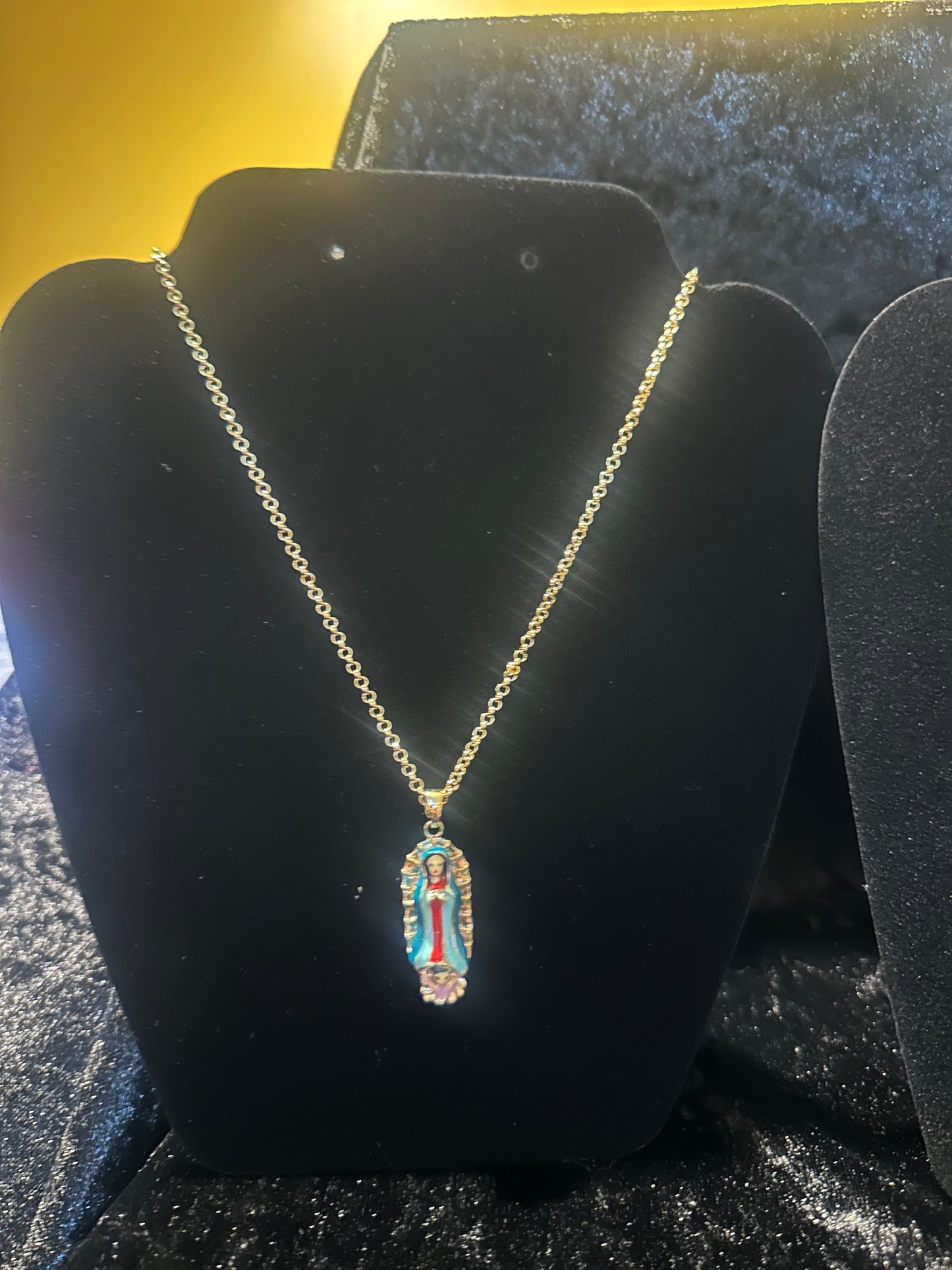 18k gold plated chain and virgin Guadalupe pendant.