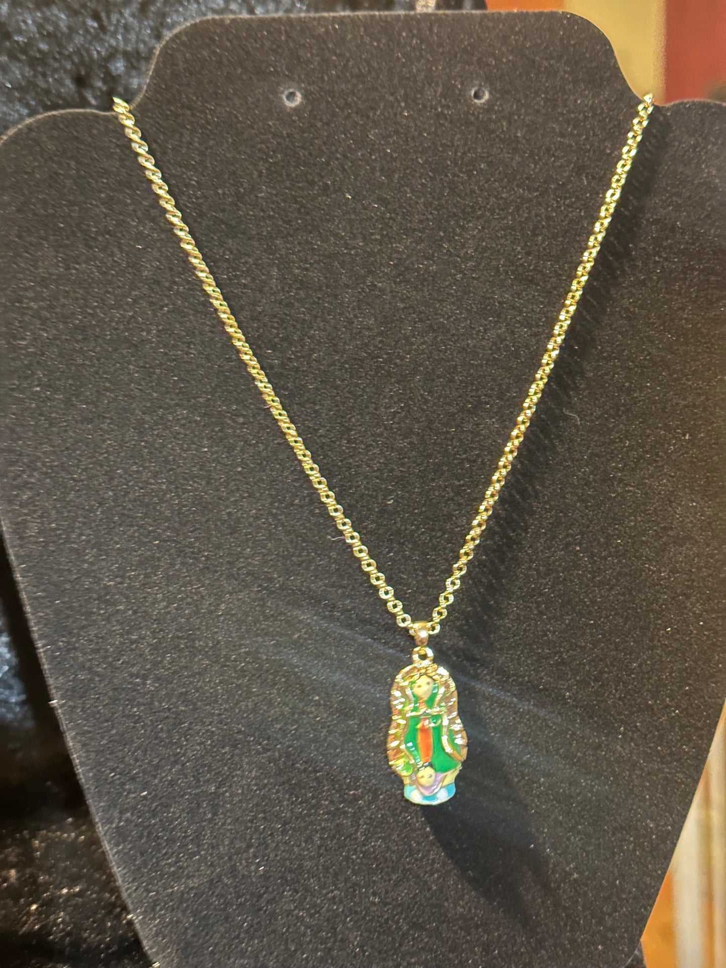 18k gold plated chain and virgin Guadalupe pendant.