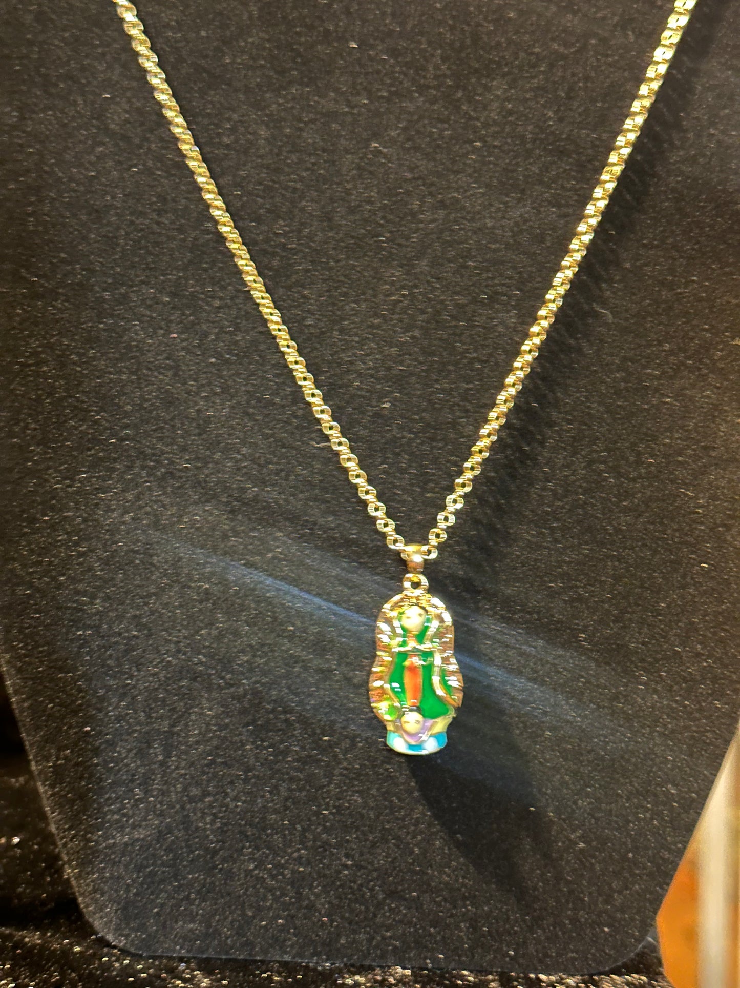 18k gold plated chain and virgin Guadalupe pendant.